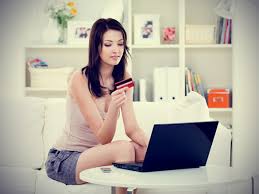 Picture_of_woman_on_computer_at_home_using_credit_card